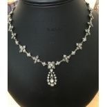 A Victorian diamond set necklace and drop pendant