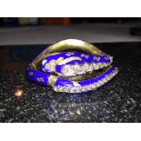 A boxed Victorian diamond and blue enamelled snake bangle, articulated in six places,
