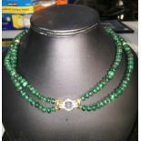 A twin-strand emerald bead necklace with 18ct diamond set clasp,