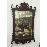 An Edwardian inlaid wall mirror