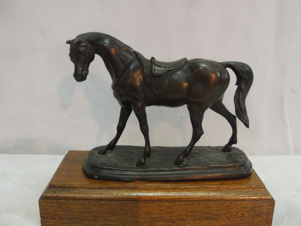 A late 19th century bronze figure of a saddled horse