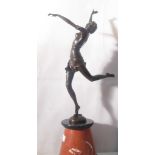 An Art Nouveau-style leaping girl on an onyx base