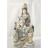 A colourful Chinese figurine of seated woman and attendant