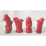 Four coral Chinese figures