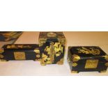 Three black lacquer jewellery caskets decorated with flowers and birds