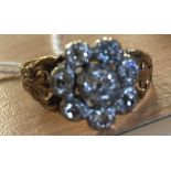 A 19th C diamond daisy ring with floral cut shoulders