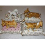 A set of four ceramic 'Dog' boxes