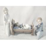 Three Lladro figures to inc children asleep in a crib No 5717;