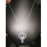 A diamond and aquamarine set pendant necklace,
