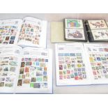 Three albums of stamps: World and GB;