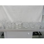 A large quantity of sets of six crystal glasses by Royal Doulton;