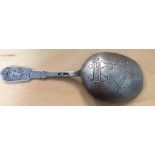 A late 19th century Russian silver caddy spoon with with parn-slavic engraving St.