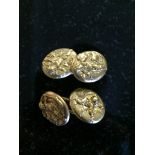 A pair of A P hallmarked gold cherub cufflinks