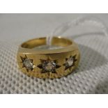 A 9ct triple diamond gypsy ring