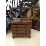 A 19th century oak chest of drawers the top with a built in linen press