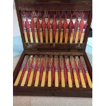 A 1920s oak cased cutlery set