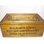 A set of five wooden 'Hogwarts' boxes