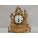 A gilt mantel clock