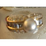 A boxed Cartier diamond and pearl ring,