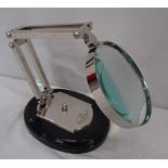 An optician's magnifying glass on stand