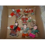 A quantity of Oriental miniature dolls