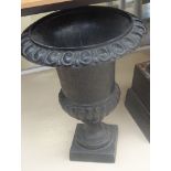 A cast iron garden urn