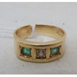 A 14k emerald and white stone ring