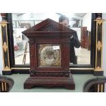 A Victorian oak mantel clock