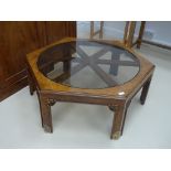 A mahogany Orientalist style octagonal glazed coffee table