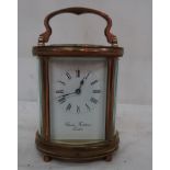 A Charles Frodsham oval carriage clock