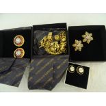 Three boxed pieces of Butler & Wilson jewellery;