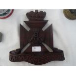 A carved plaque for the Wiltshire Regiment