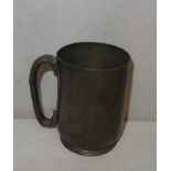 A pewter mug with the inscription "My Dearest George Brough: Much Faster Than Any Camel, Yours T.