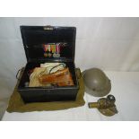 A WWII Desert Rat serviceman's items: tin box, medals, holster, letters, tin hat,