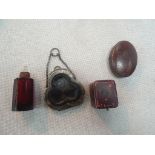 A miniature Victorian trefoil sovereign purse, red bottle,