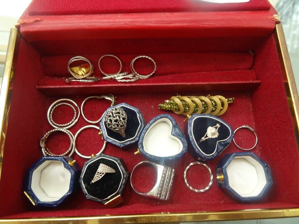 Various silver rings and earrings