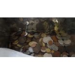 A glass jar of World and GB coins