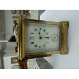 A 19th century carriage clock in carrying case