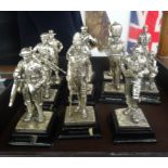 A collection of metal figures of various soldiers from different regiments.