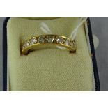 An 18ct gold and diamond half eternity ring