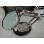 An optician's magnifying glass on stand