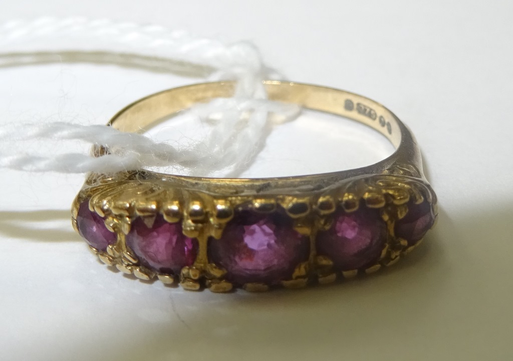 A five-stone garnet dress ring