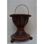 An Edwardian mahogany inlaid mahogany wine cooler with brass inner