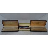 A boxed Dunhill fountain pen and pencil with an engine-turned decoration;