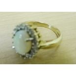 A 9ct opal and diamond dress ring