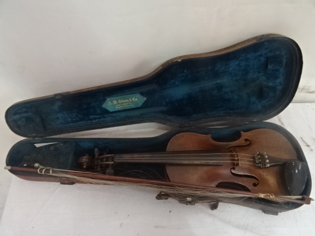 A cased violin bearing label 'John Lister', maker Leeds,