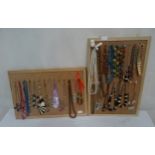 Two boards set with 31 dress necklaces