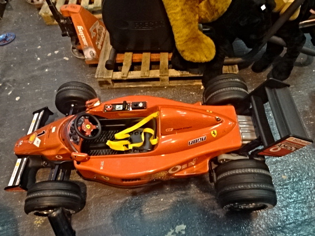 A child's electric Formula 1 Ferrari car