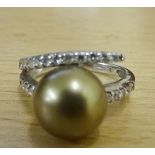 An 18ct diamond and pearl ring