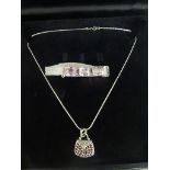 A cased silver necklace & garnet set handbag/pillbox pendant & silver amethyst bracelet comprising